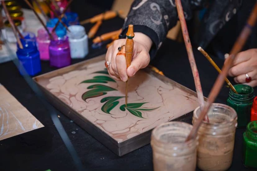 Ebru, traditional water marbling: colour is floated on a tray of liquid before paper is laid on top